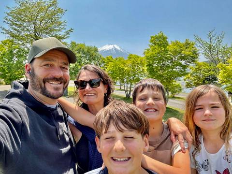 Family portrait with Mount Fuji in the background.