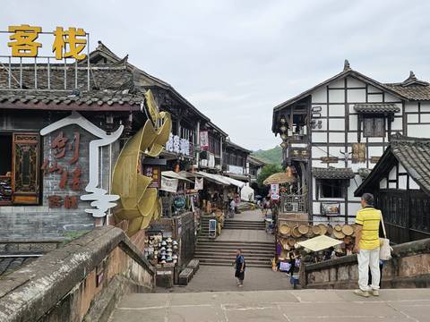       Traditional Chinese street with tourists.
  