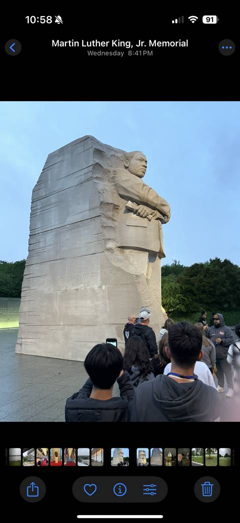 Stone statue with quote, resembling Martin Luther King Jr.