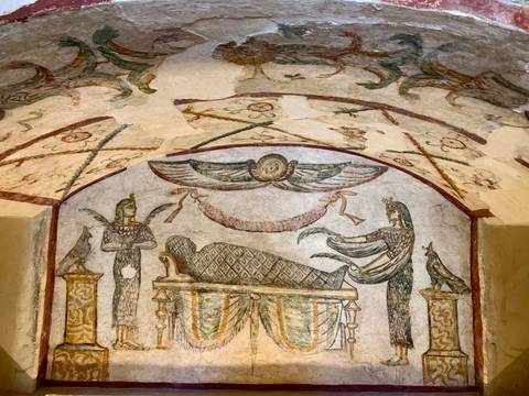       Ancient mural depicting Egyptian mythology with vibrant colors.
  