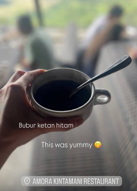       Cup of dark drink with overlay text 'Bubur ketan hitam'.
  