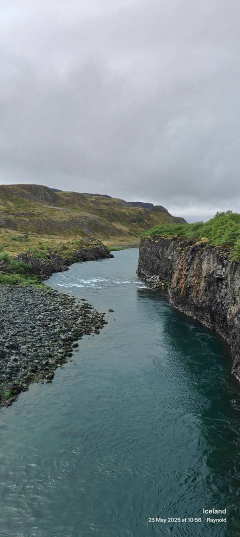 Wide river cutting through a rocky landscape.