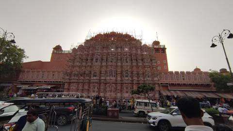       A large, historical building under renovation with scaffoldings.
  
