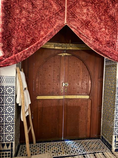 Elaborate wooden door with intricate patterns.