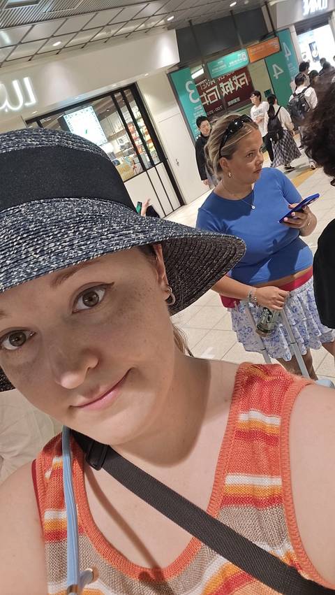       Close-up of a person wearing a hat.
  