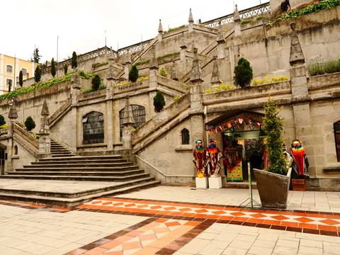       Stone steps leading to a historic building with colorful decorations.
  