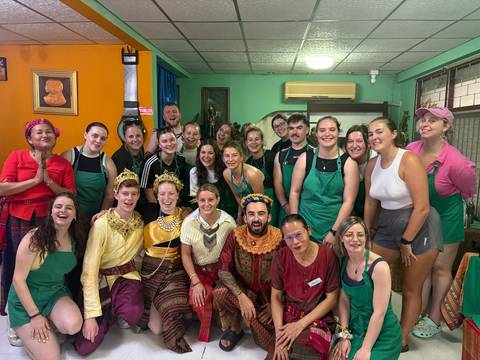       Large group of people in bright colorful clothing.
  