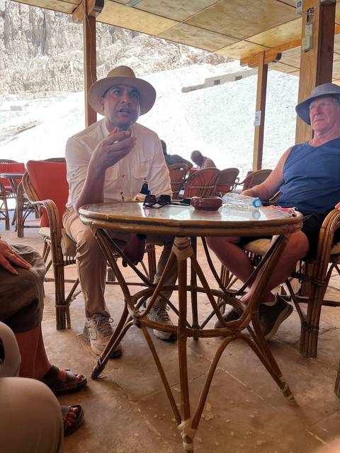 People sitting around a table having a discussion.