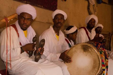 Group of musicians playing traditional instruments.