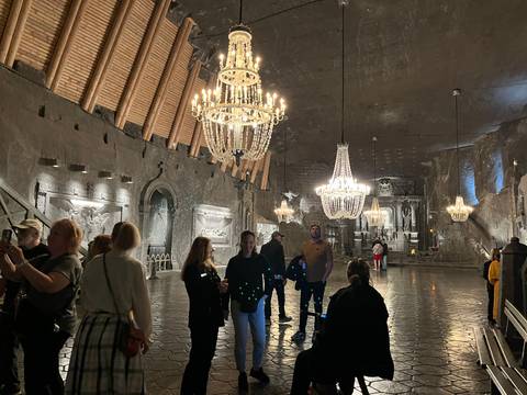       Underground hall with chandeliers inside a salt mine.
  