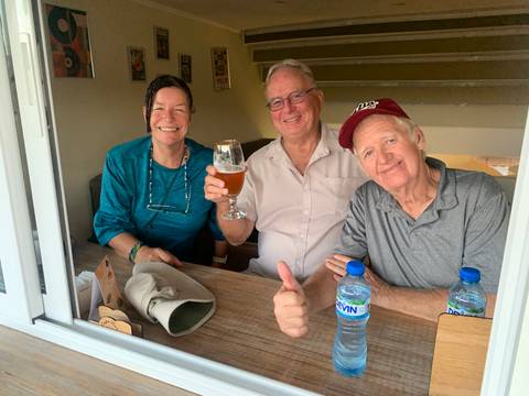 Group of people enjoying drinks at a table