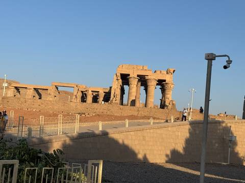       Ancient ruins of a temple with stone columns.
  