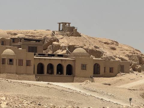       Desert buildings with a barren landscape.
  