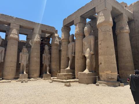       Gigantic stone statues within an ancient temple.
  