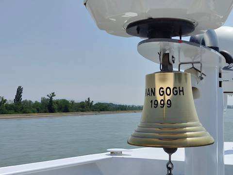       Brass ship bell engraved with 'Van Gogh 1999' on a river cruise.
  