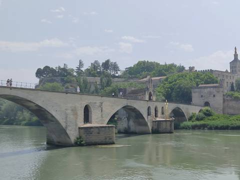       Historic bridge crossing a calm river.
  