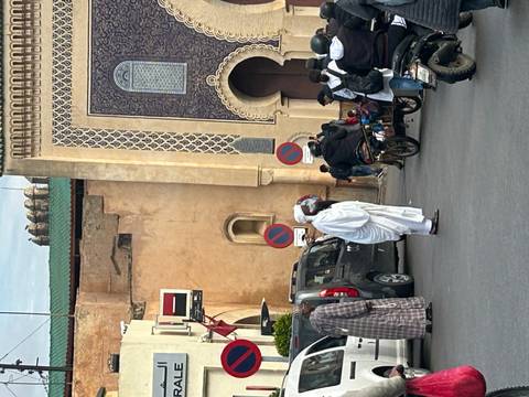       Street scene with people and historic architecture.
  