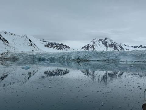       Glacial landscape with reflection on water.
  