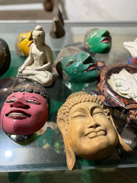       Close-up of various colorful masks laid out on a table.
  