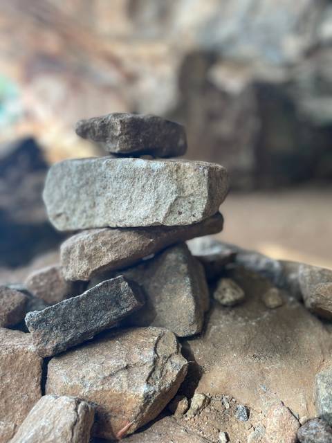 Stacked stones with blurred background.