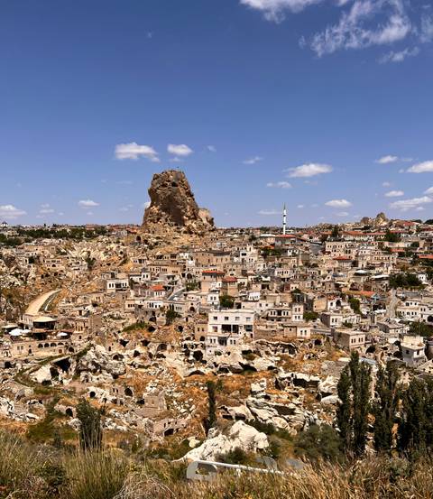 Wide view of an ancient town with distinct rock formations.