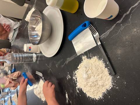       Cooking ingredients and utensils on a table.
  
