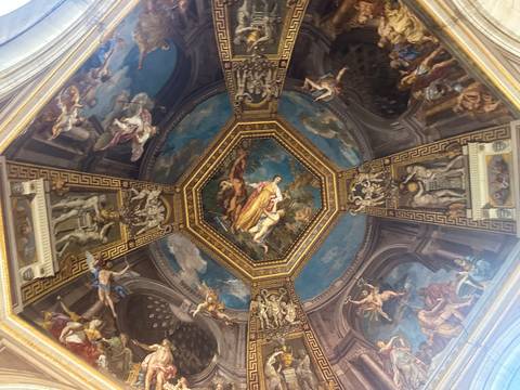       Intricately painted ceiling in a historical building.
  