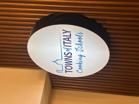       Sign for a cooking school.
  