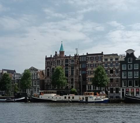 Scenic view of canal with traditional Dutch architecture.