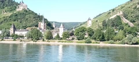       A village and two castles on the hills overlooking the river.
  