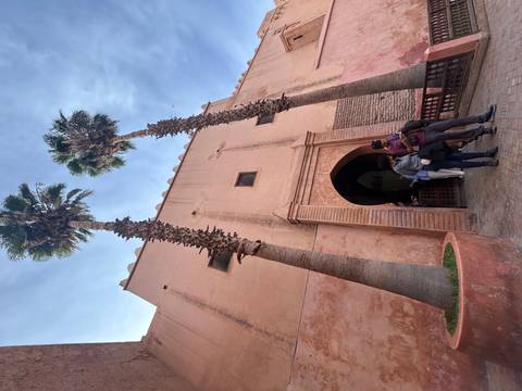 View of a desert landscape through a rock arch.