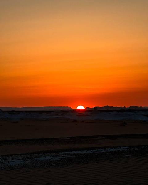 Sunset over the desert landscape.