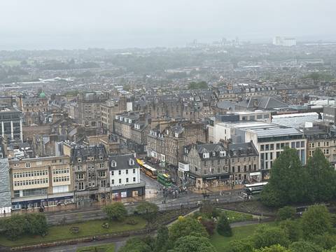 Aerial view of a city with traditional and modern buildings.