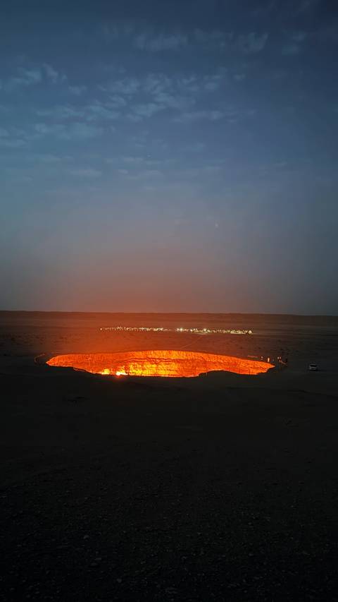 Glowing crater in a desert setting.