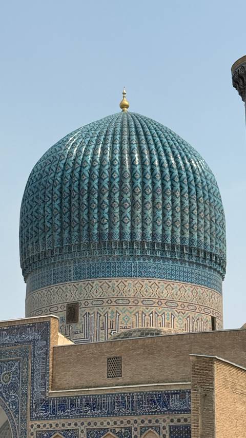       Close-up of a mosaic patterned dome.
  