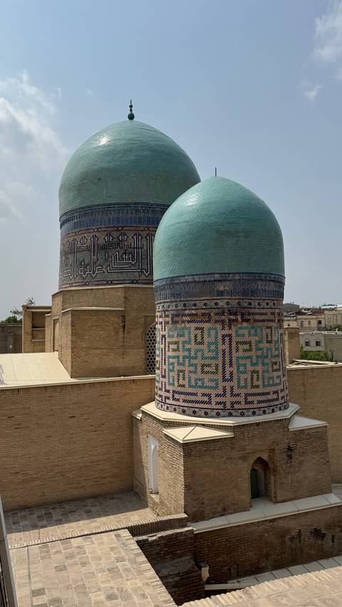 Two intricately detailed domes on historical buildings.