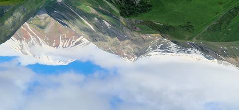 Snow-capped mountains under a clear blue sky.