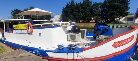 Close-up of a boat docked with visible equipment.