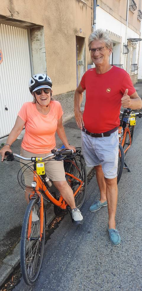 Close-up of two cyclists and their bikes.