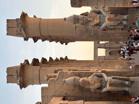 Ancient temple ruins with large statues.