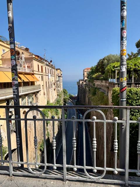 Street view from Sorrento with the sea in the distance.