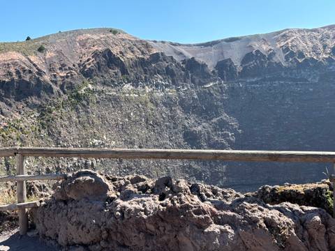 Edge of Mount Vesuvius crater, rocky landscape.