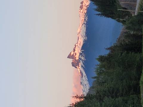 Snow-capped mountain peaks at sunset.