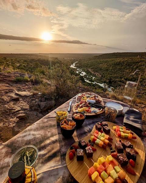       People in a safari vehicle on a journey.
  