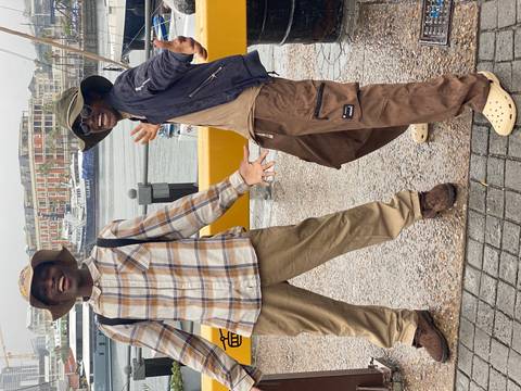       Group of friends smiling for a selfie at night.
  