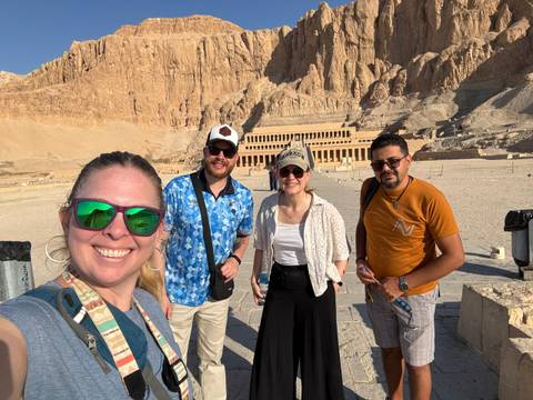 Group of people posing in front of the Temple of Hatshepsut.