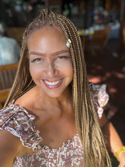       Close-up selfie of a person with braided hair.
  