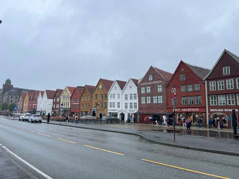       Colorful historic waterfront buildings on a rainy day.
  