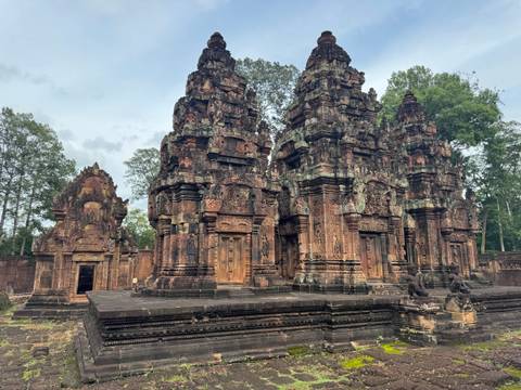 Ancient temple ruins with detailed carvings and statues.