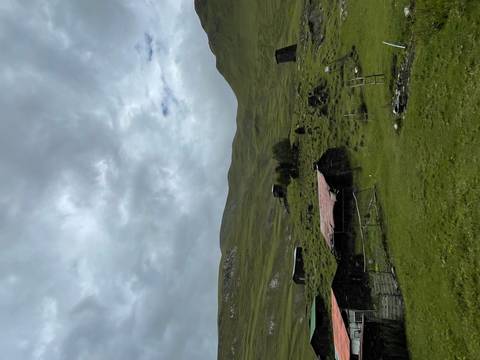       Mountain village with rustic buildings.
  